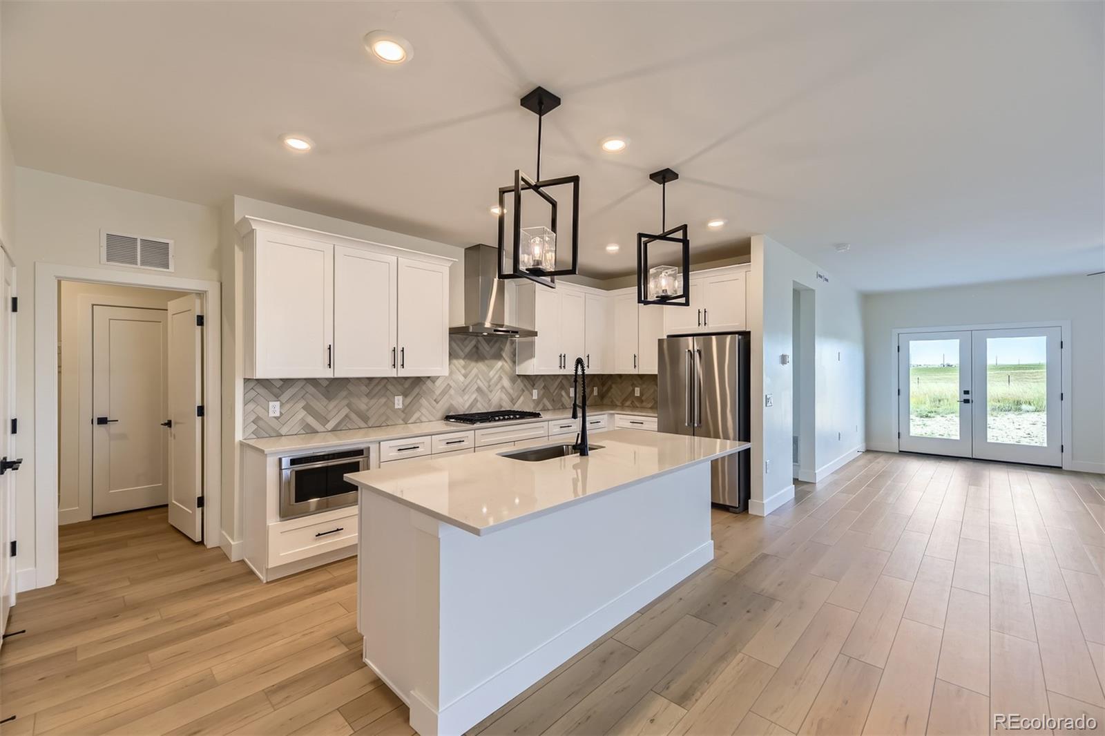 42974 Colonial Trail Elizabeth, CO 80107 - Photo 4 of 27 a kitchen with a stove and a sink