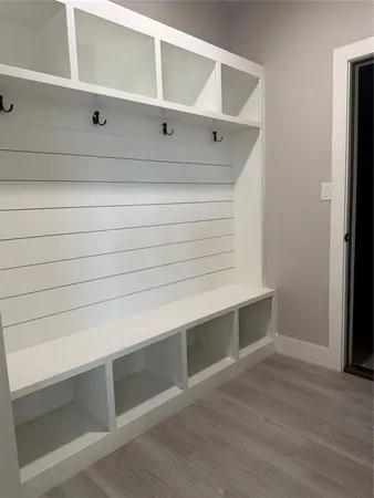 a kitchen with granite countertop a sink a stove and cabinets