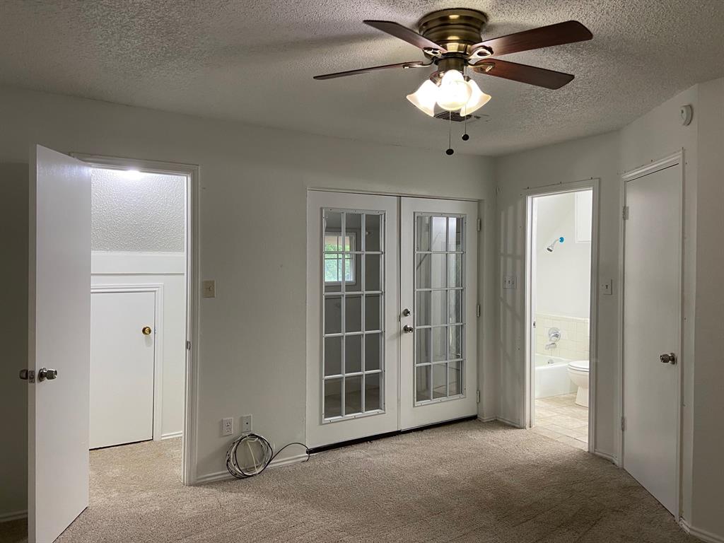 1440 Weiler Boulevard Fort Worth, TX 76112 - Photo 4 of 11 a view of a livingroom with a chandelier fan