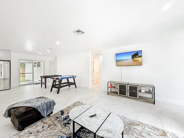 a living room with furniture gym equipment and a couch