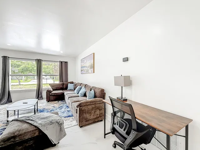 a living room with furniture and a window