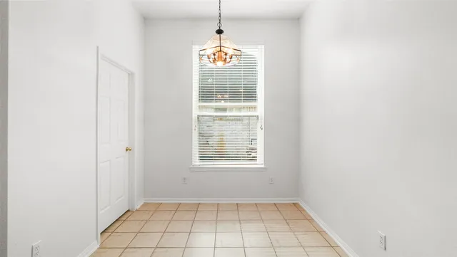 a view of an empty room with windows