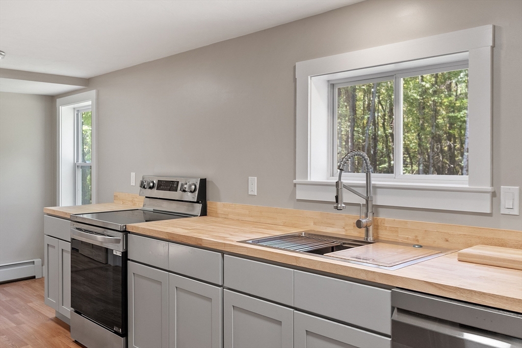 34 Morse Road Royalston, MA 01368 - Photo 36 of 42 a kitchen with a stove and a sink