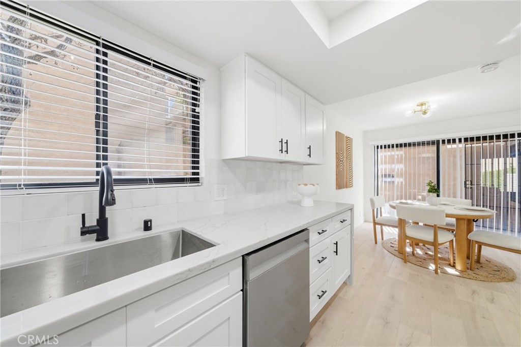 2714 Via Colina, Unit 12 Fullerton, CA 92835 - Photo 13 of 32 a view of a kitchen counter space with furniture and windows