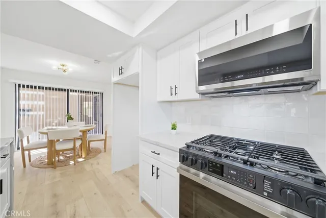 a kitchen with a stove and a microwave