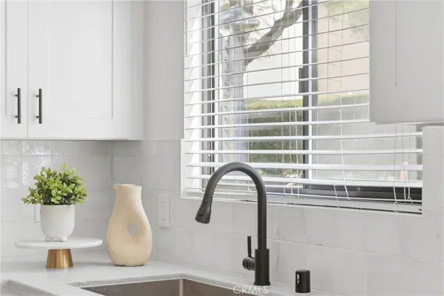 a spacious bedroom with a large bed and a large window