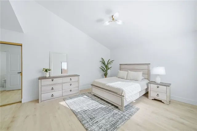 a bedroom with a bed and a cabinets