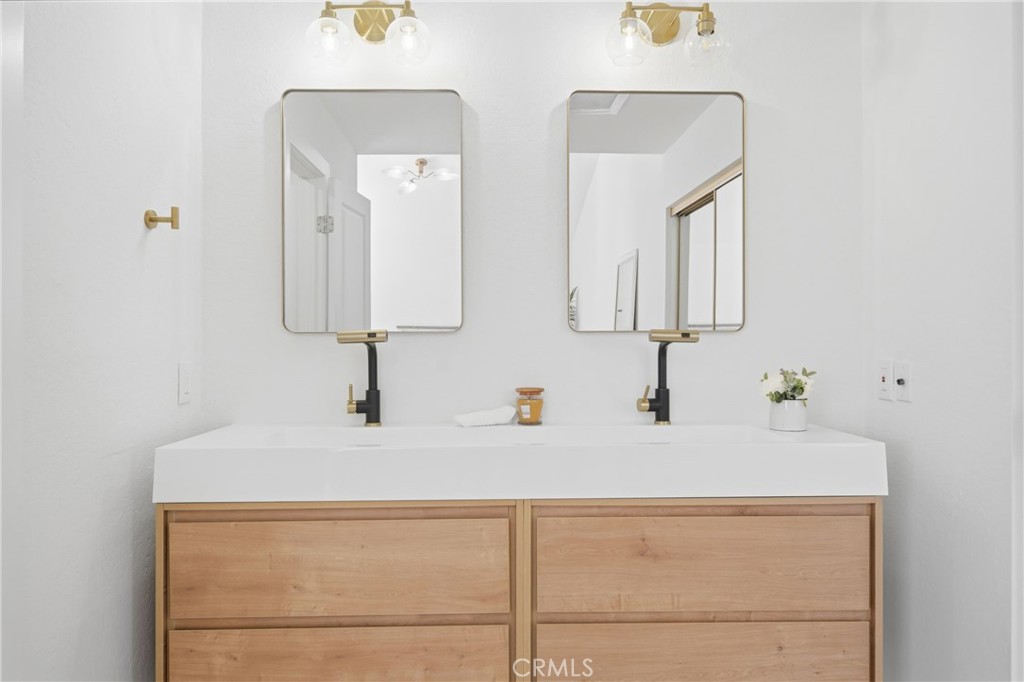 2714 Via Colina, Unit 12 Fullerton, CA 92835 - Photo 21 of 32 a bathroom with a sink and a mirror