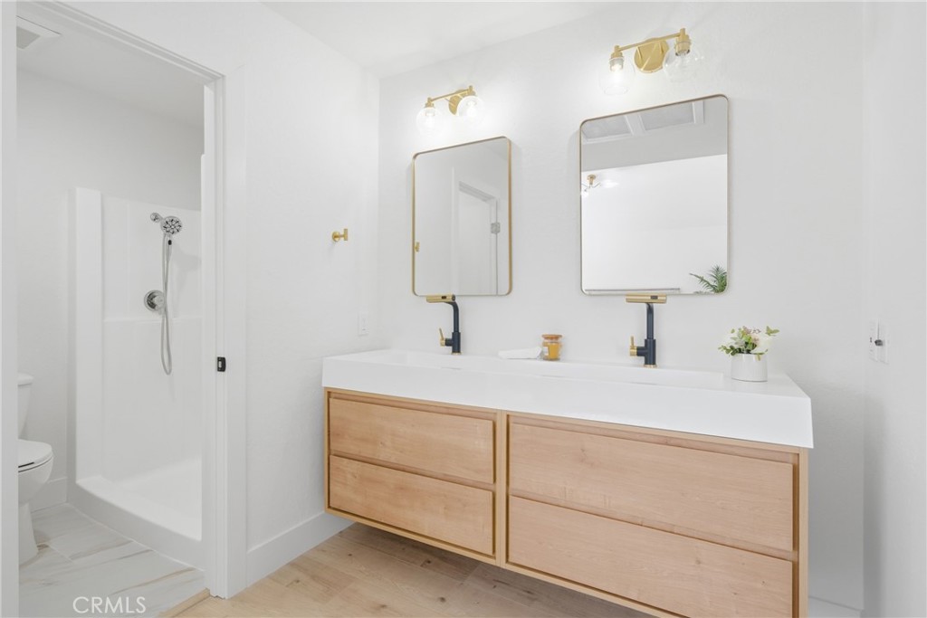2714 Via Colina, Unit 12 Fullerton, CA 92835 - Photo 22 of 32 a bathroom with a sink vanity and mirror
