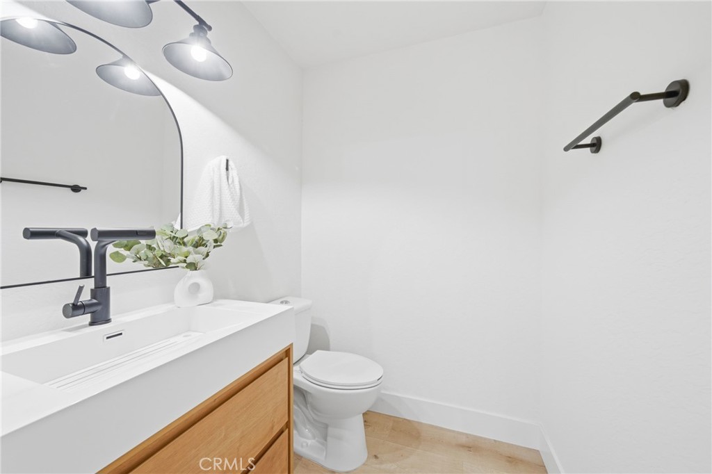 2714 Via Colina, Unit 12 Fullerton, CA 92835 - Photo 24 of 32 a bathroom with a sink a toilet and mirror