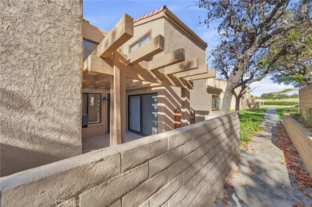a view of a patio with two couches and table in the patio