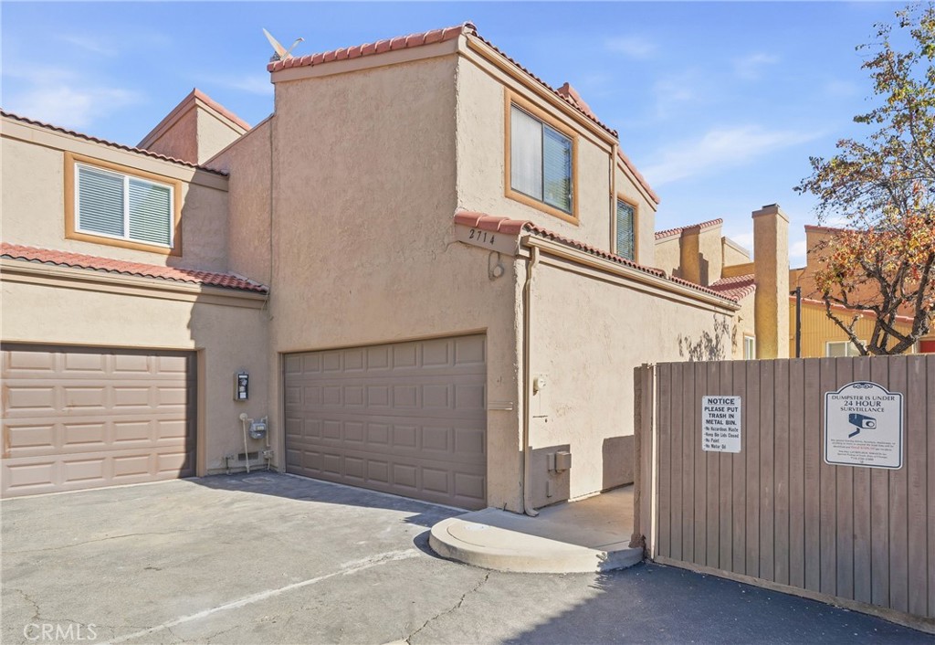 2714 Via Colina, Unit 12 Fullerton, CA 92835 - Photo 32 of 32 a front view of a house with a garage