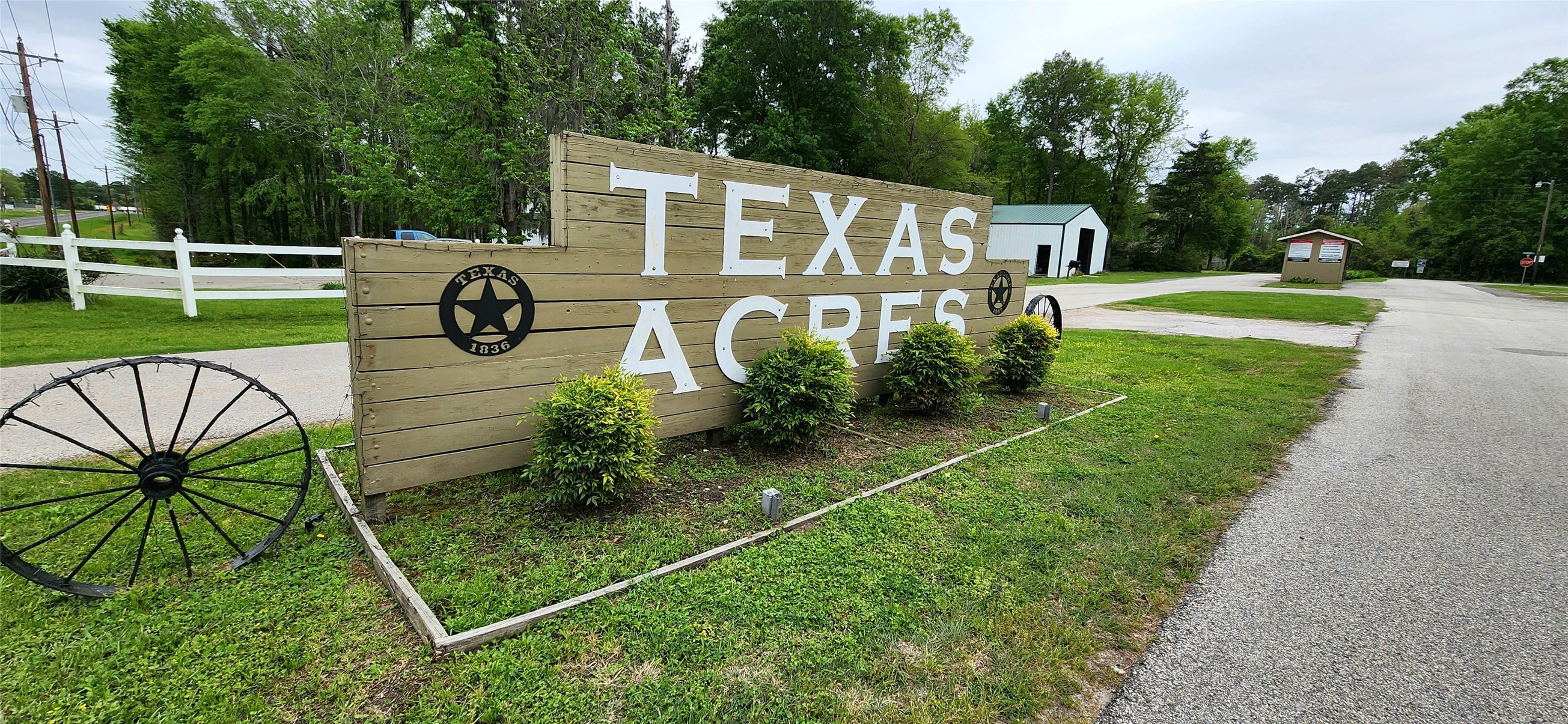 Tbd Angus Drive Onalaska, TX 77360 - Photo 5 of 6 a front view of a house with garden