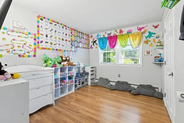 a room with toys and dresser