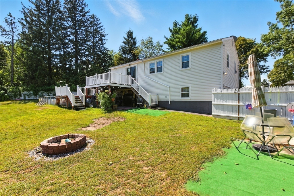 169 Berkeley Street Methuen, MA 01844 - Photo 27 of 31 a view of a swimming pool with a chair and tables