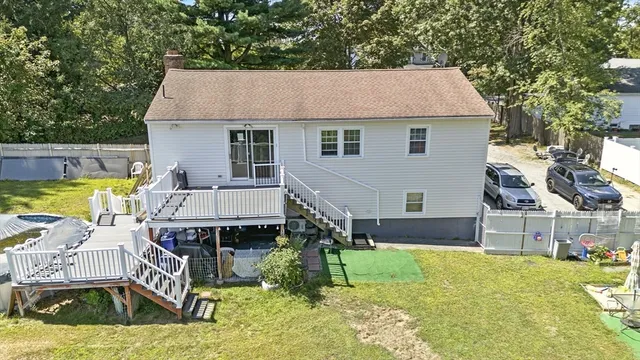 a aerial view of a house with swimming pool and sitting area