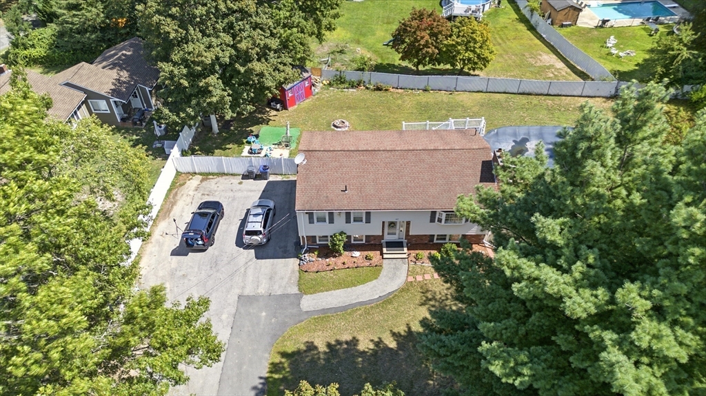 169 Berkeley Street Methuen, MA 01844 - Photo 29 of 31 an aerial view of a house with swimming pool and garden