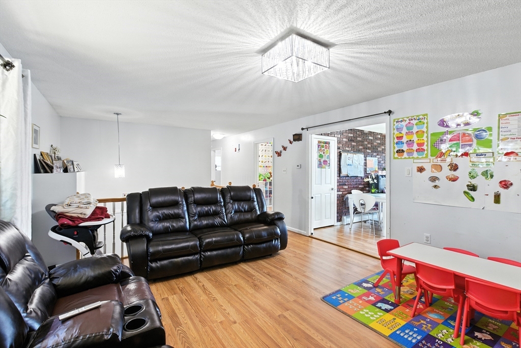 169 Berkeley Street Methuen, MA 01844 - Photo 5 of 31 a living room with furniture and a couch