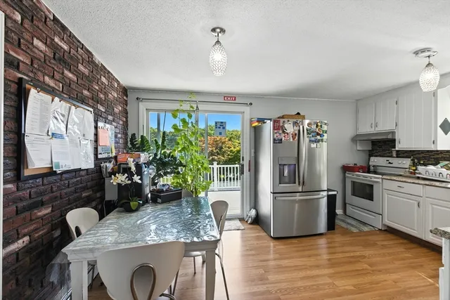 a kitchen with refrigerator and sink