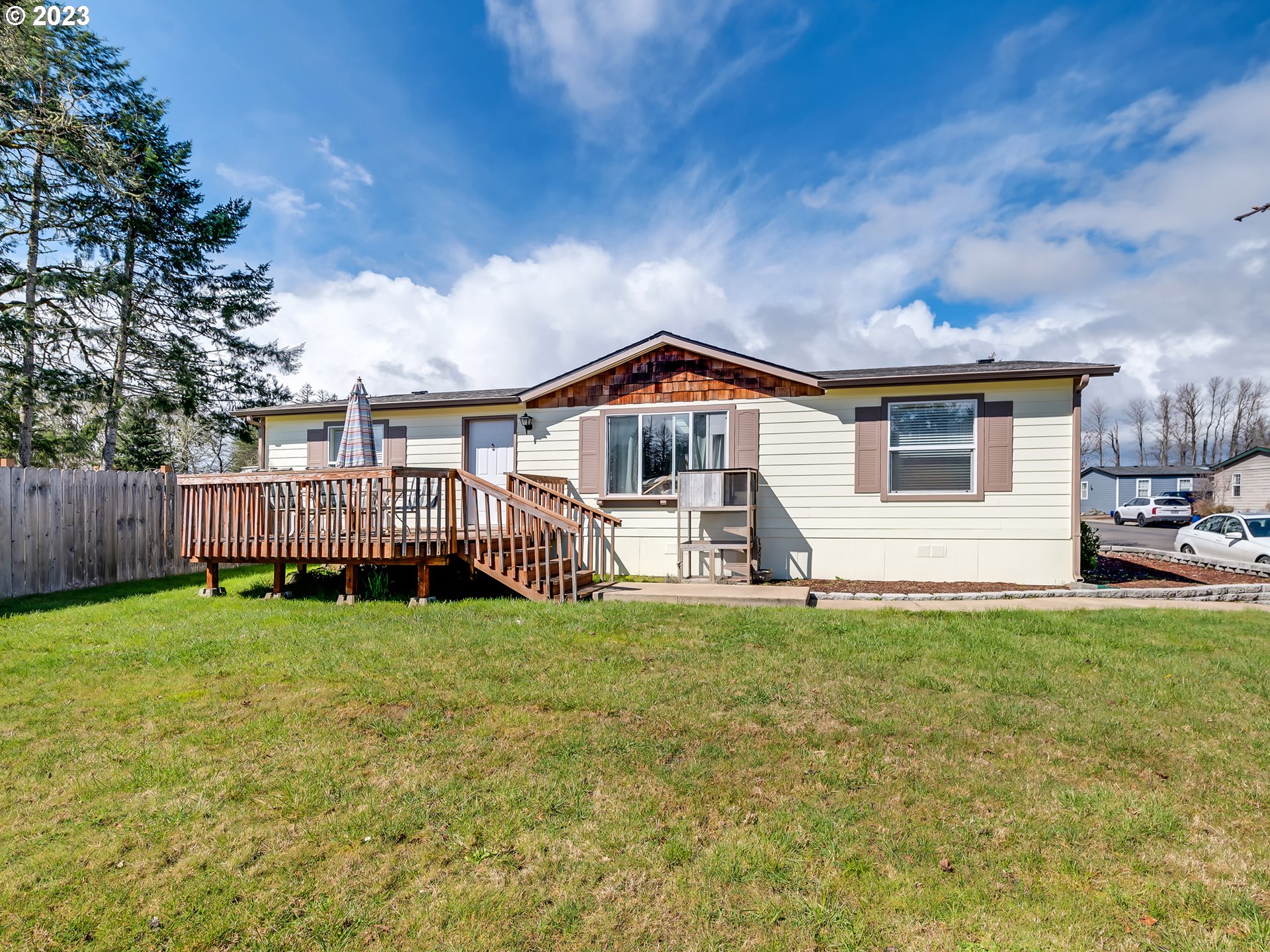 29720 Jeans Road, Unit 22 Veneta, OR 97487 - Photo 1 of 30 a view of a house with a yard and deck