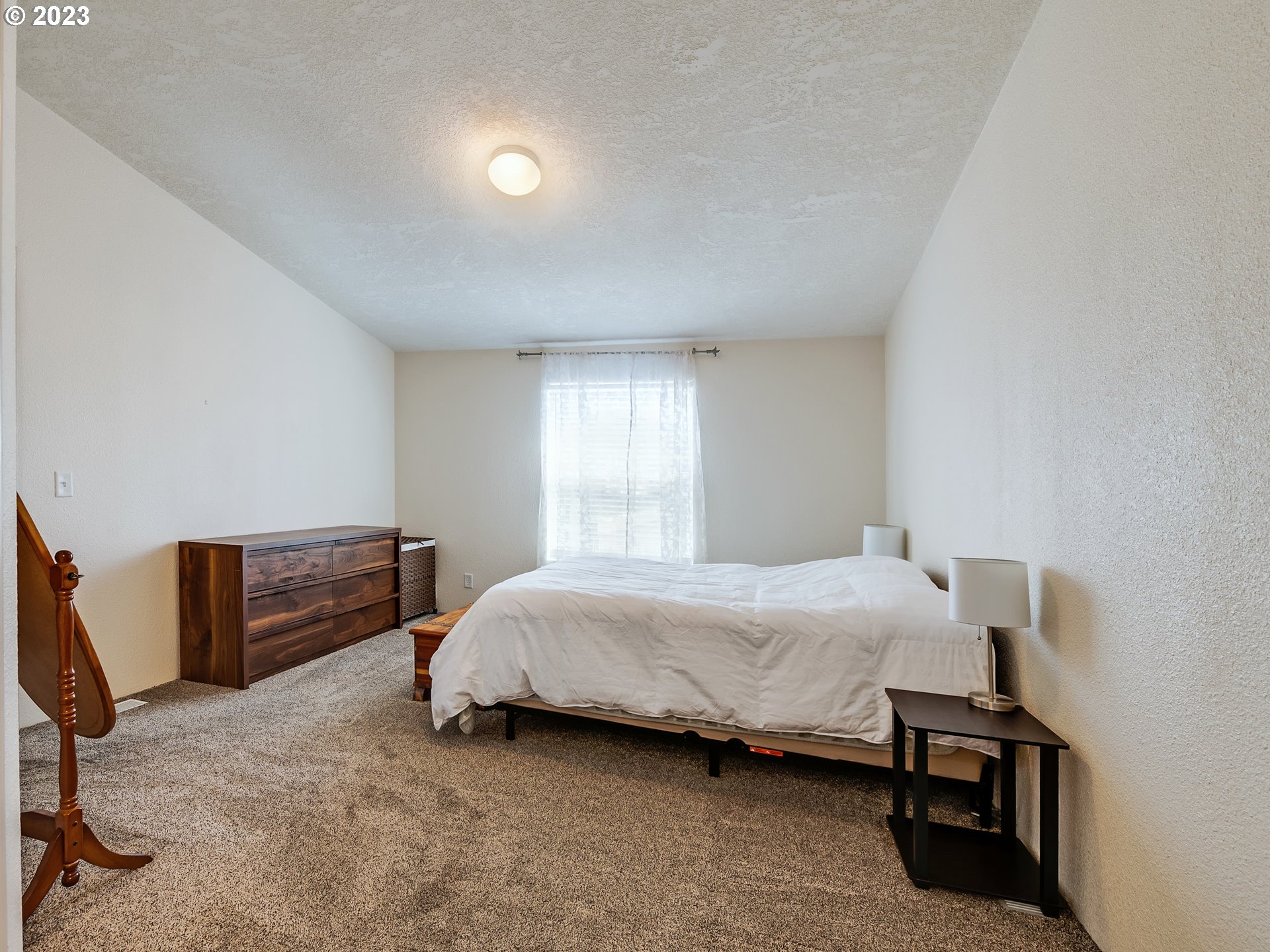29720 Jeans Road, Unit 22 Veneta, OR 97487 - Photo 15 of 30 a bedroom with a bed and a window