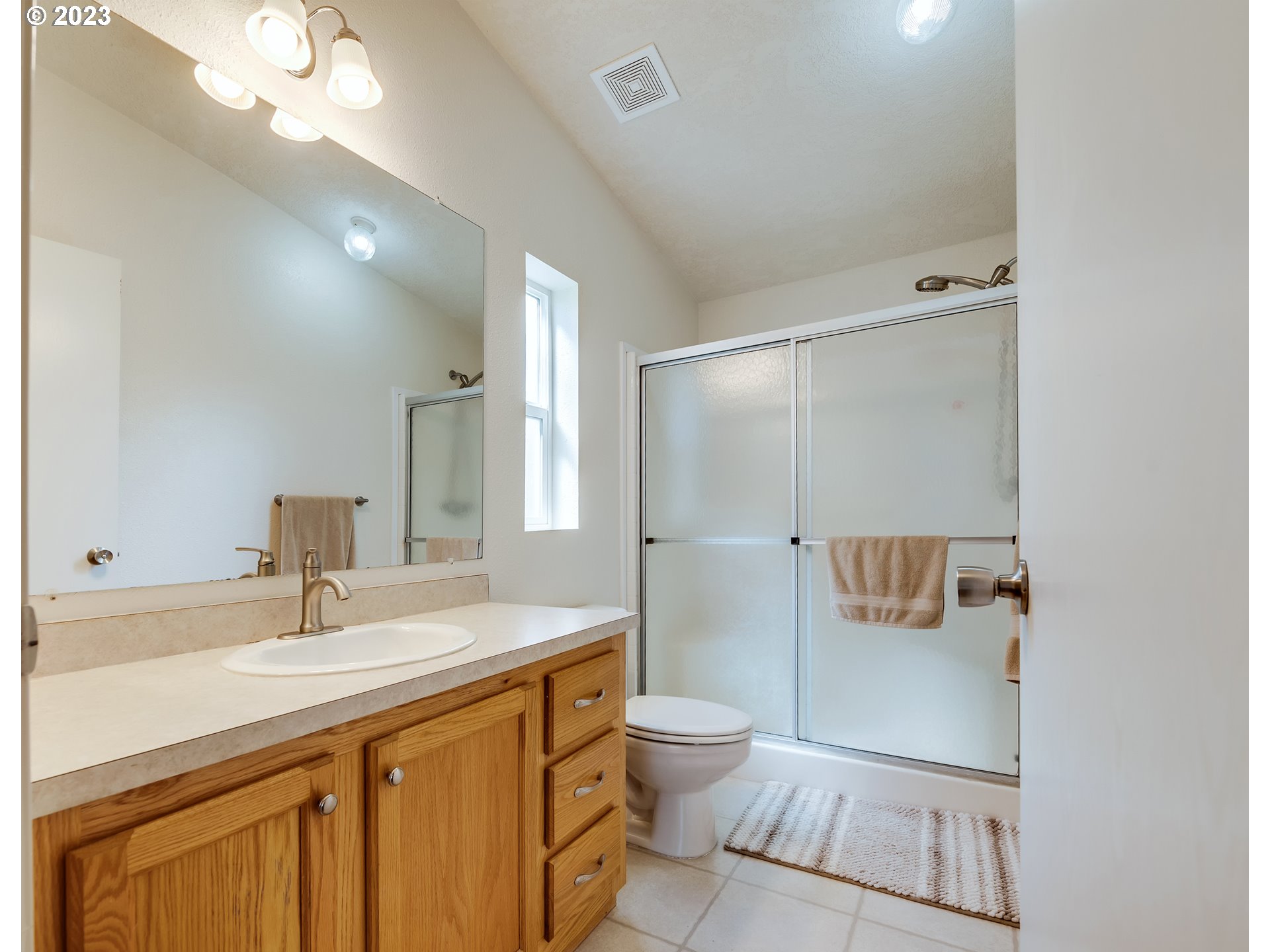 29720 Jeans Road, Unit 22 Veneta, OR 97487 - Photo 17 of 30 a bathroom with a sink a toilet and shower