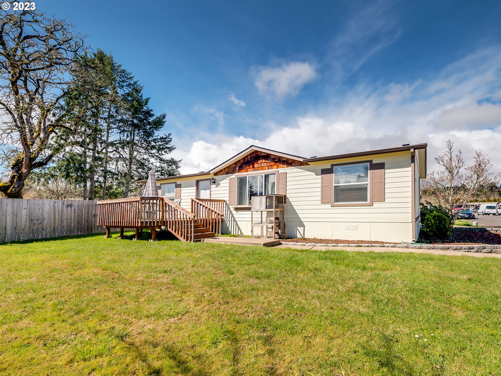 29720 Jeans Road, Unit 22 Veneta, OR 97487 - Photo 2 of 30 a big house with a big yard and large trees