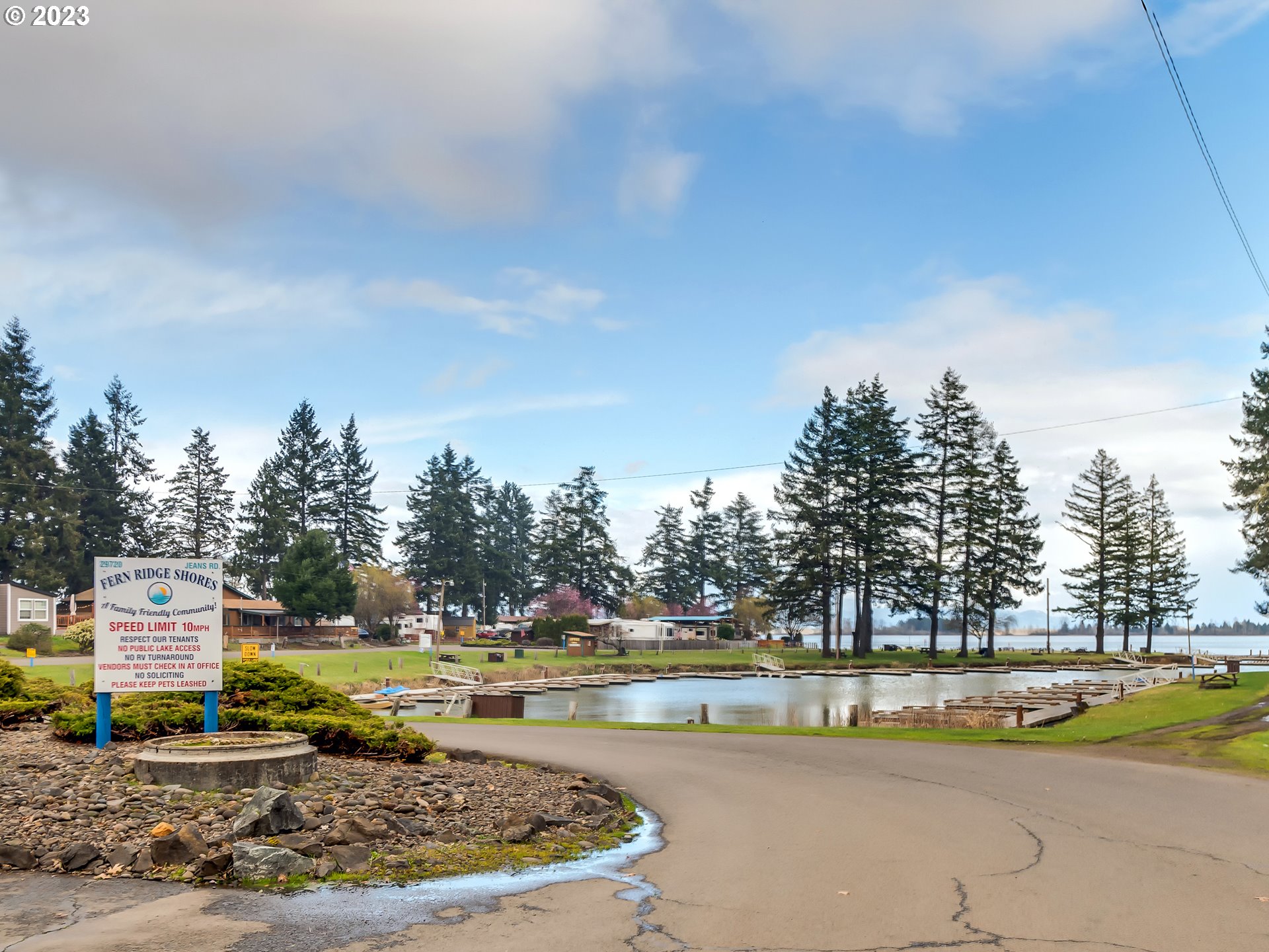 29720 Jeans Road, Unit 22 Veneta, OR 97487 - Photo 29 of 30 a view of a swimming pool and trees in the background