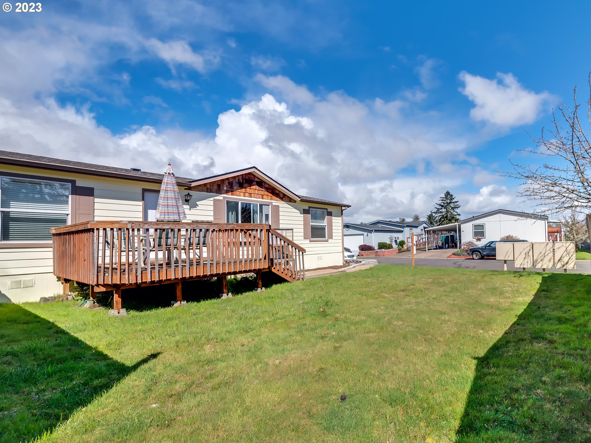29720 Jeans Road, Unit 22 Veneta, OR 97487 - Photo 4 of 30 a view of a house with a yard and deck