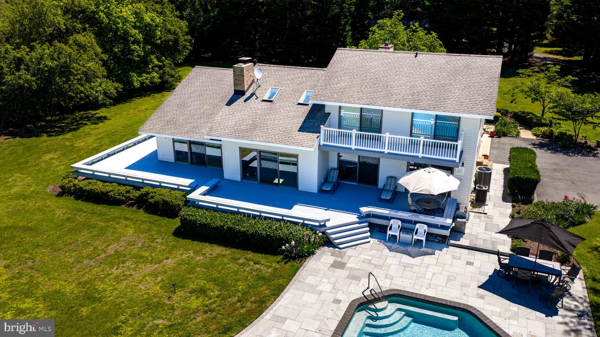 26282 Deep Water Harbor Road Easton, MD 21601 - Photo 38 of 53 an aerial view of a house with swimming pool garden and patio