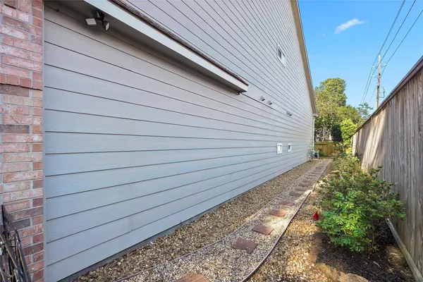 a view of a pathway with a backyard
