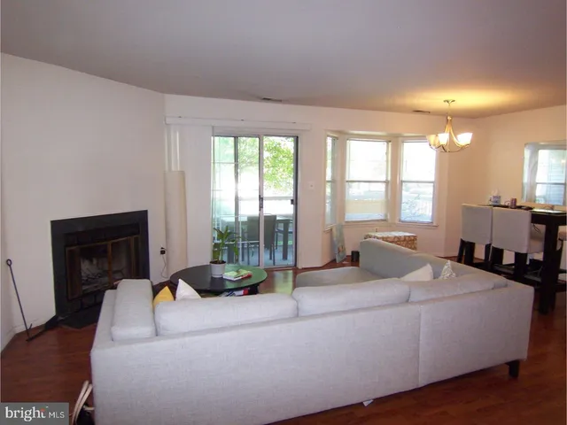 a kitchen with a sink a stove and cabinets