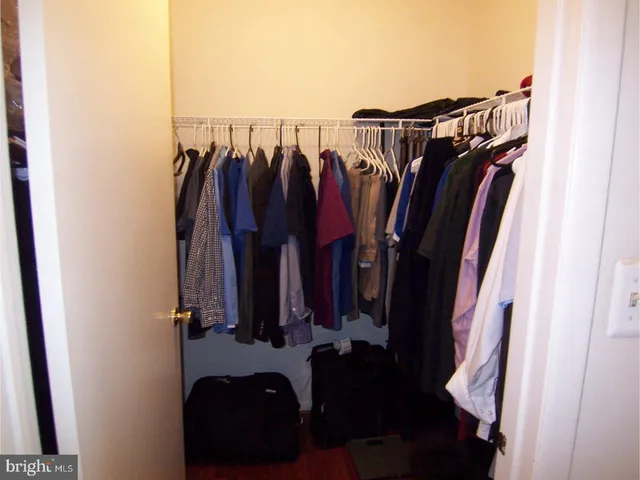 a livingroom with lounge chair and a window