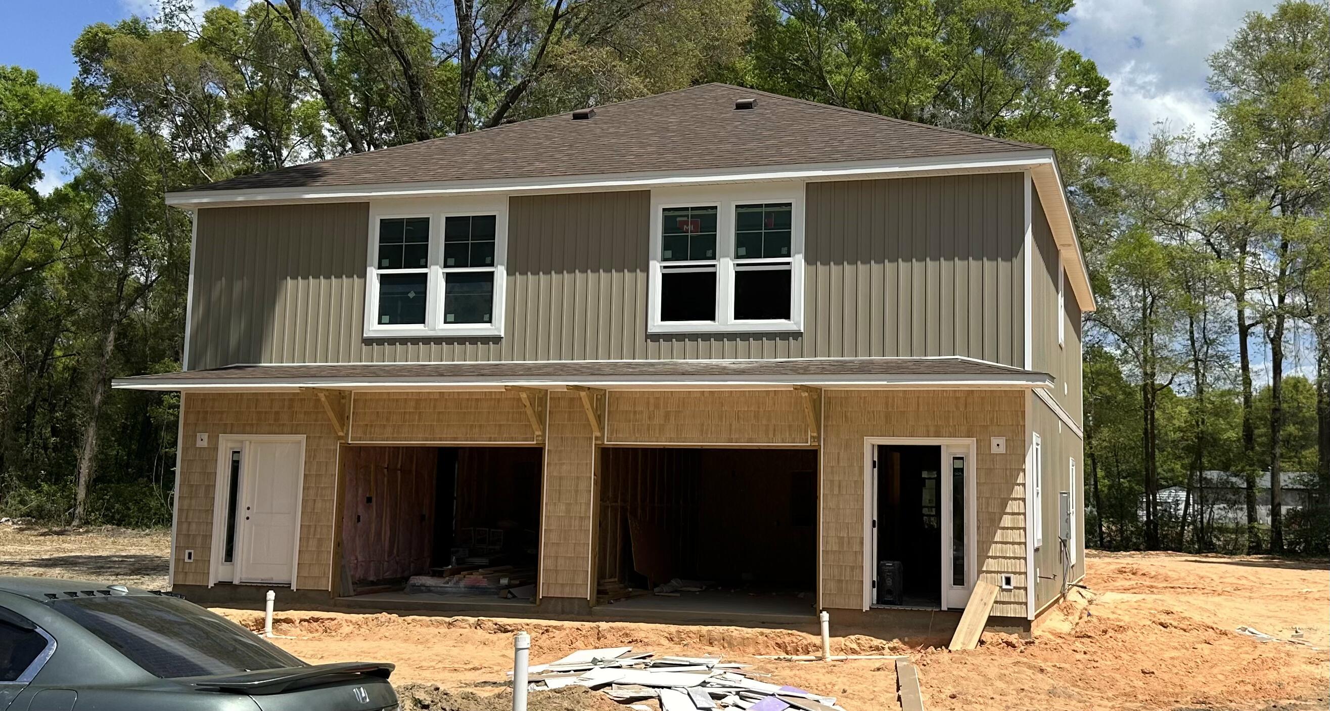 161 South Booker Street, Unit A B Crestview, FL 32536 - Photo 1 of 1 a front view of a house with a yard