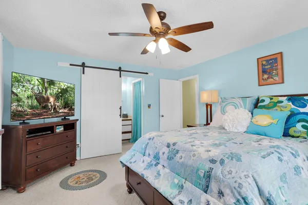 an aerial view of residential houses with outdoor space and parking