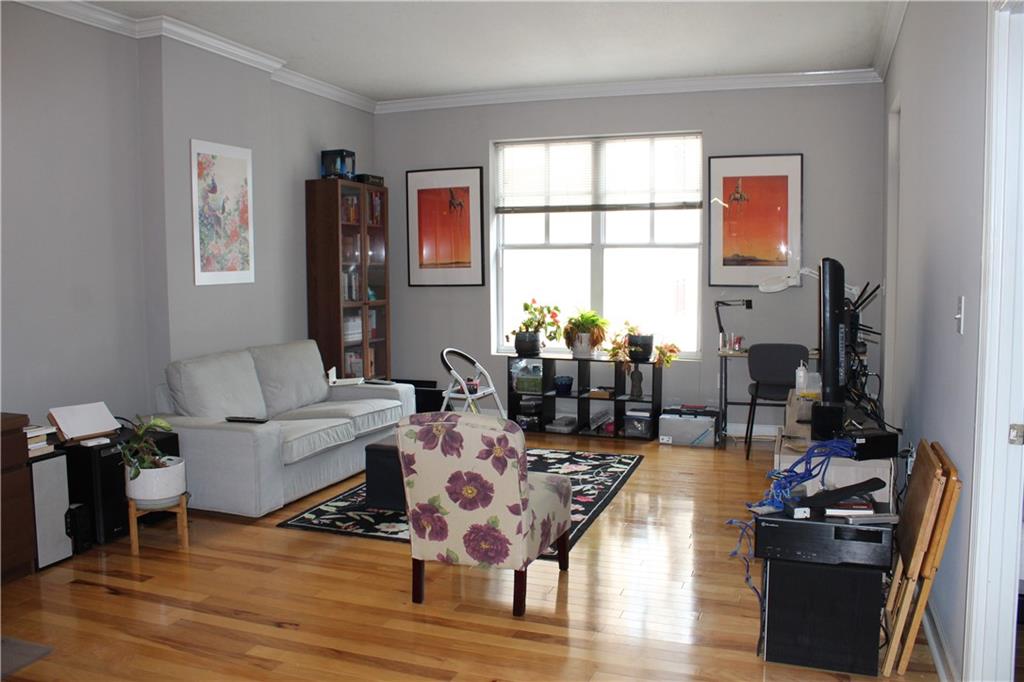 1101 Juniper Street Northeast, Unit 1416 Atlanta, GA 30309 - Photo 10 of 48 a living room with furniture large window and wooden floor