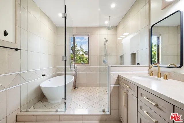 a bathroom with a bathtub sink and toilet