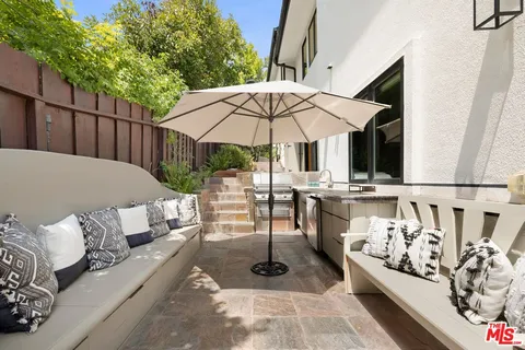 swimming pool view with a seating space