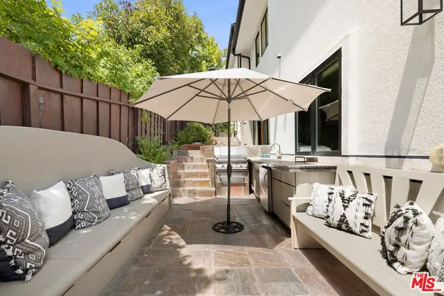 swimming pool view with a seating space