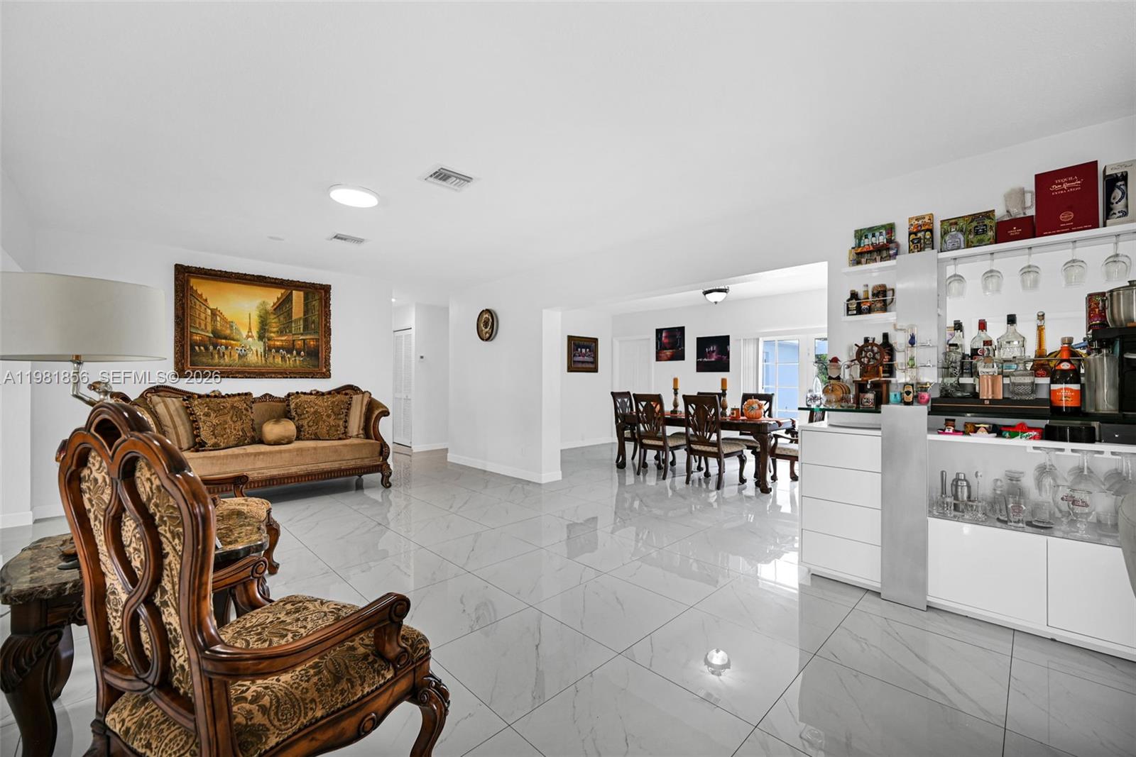 756 West 53rd Street Hialeah, FL 33012 - Photo 13 of 65 a living room with furniture and a table