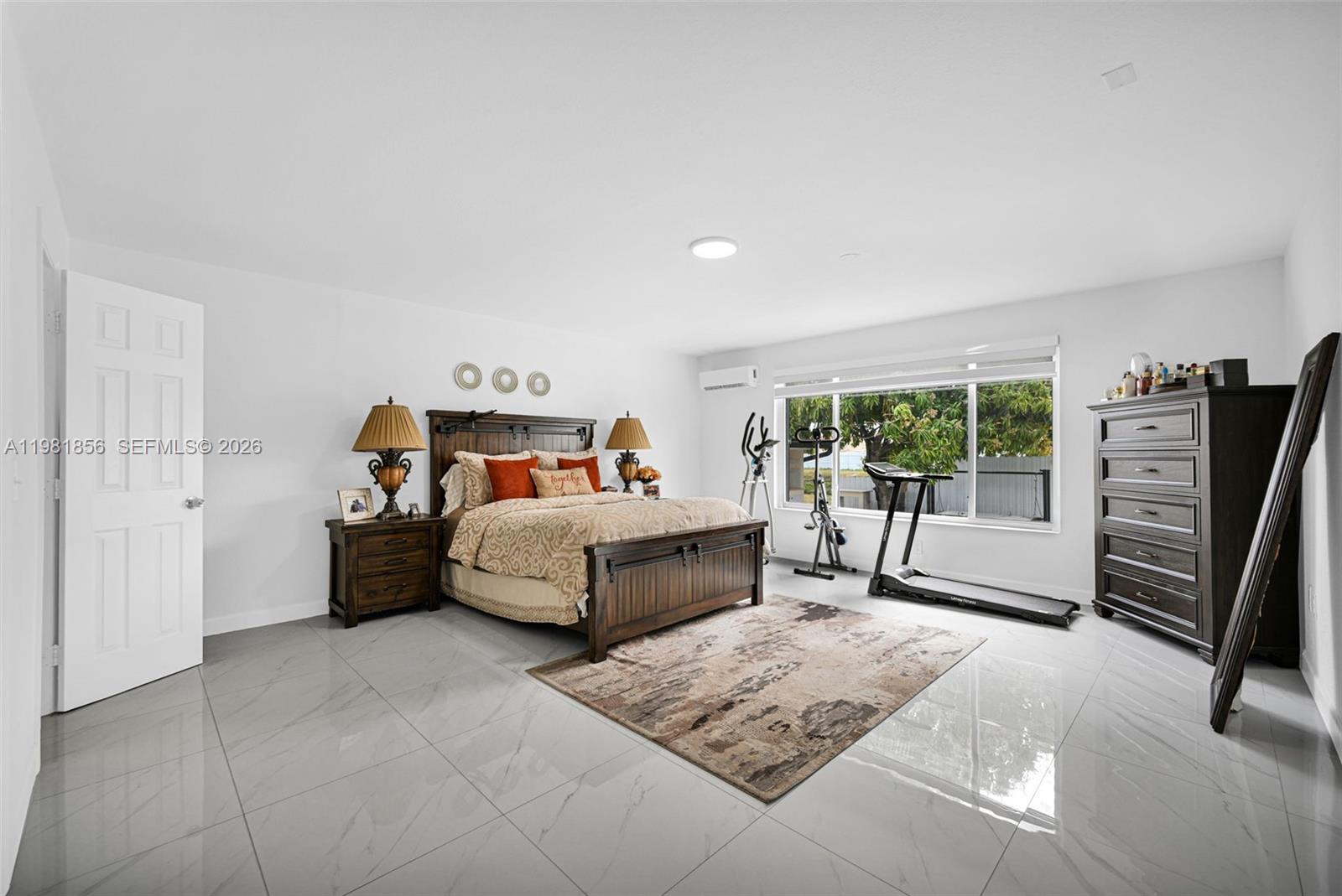 756 West 53rd Street Hialeah, FL 33012 - Photo 22 of 65 a bedroom with a bed and a couch