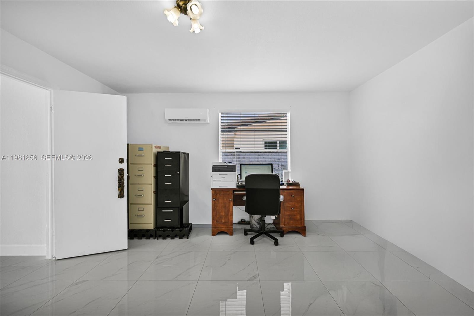 756 West 53rd Street Hialeah, FL 33012 - Photo 31 of 65 a view of a workspace with furniture