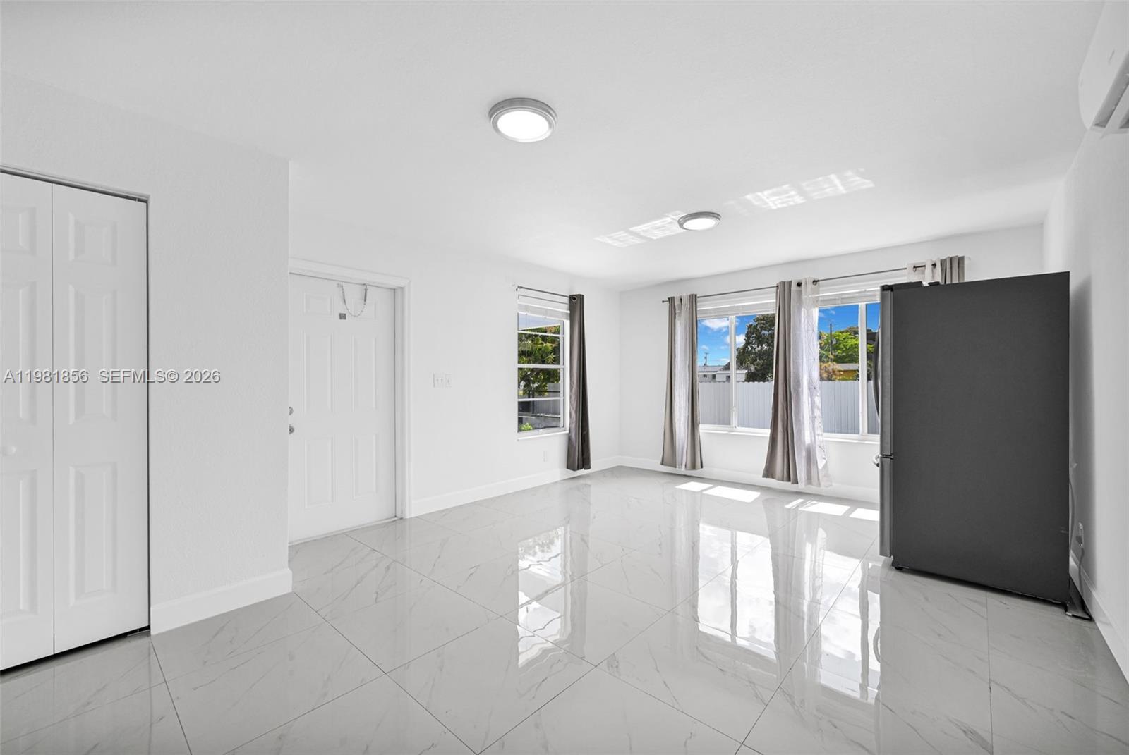 756 West 53rd Street Hialeah, FL 33012 - Photo 35 of 65 a view of an empty room with kitchen