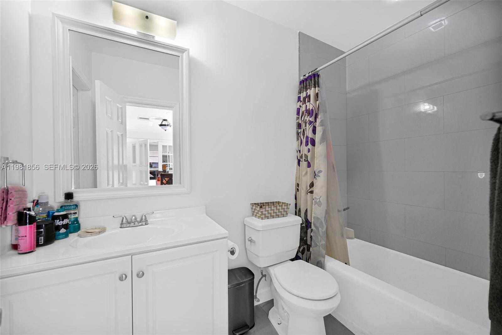 756 West 53rd Street Hialeah, FL 33012 - Photo 41 of 65 a bathroom with a sink a toilet and shower