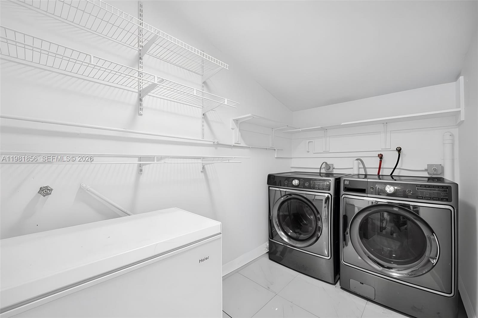 756 West 53rd Street Hialeah, FL 33012 - Photo 44 of 65 a utility room with dryer and washer