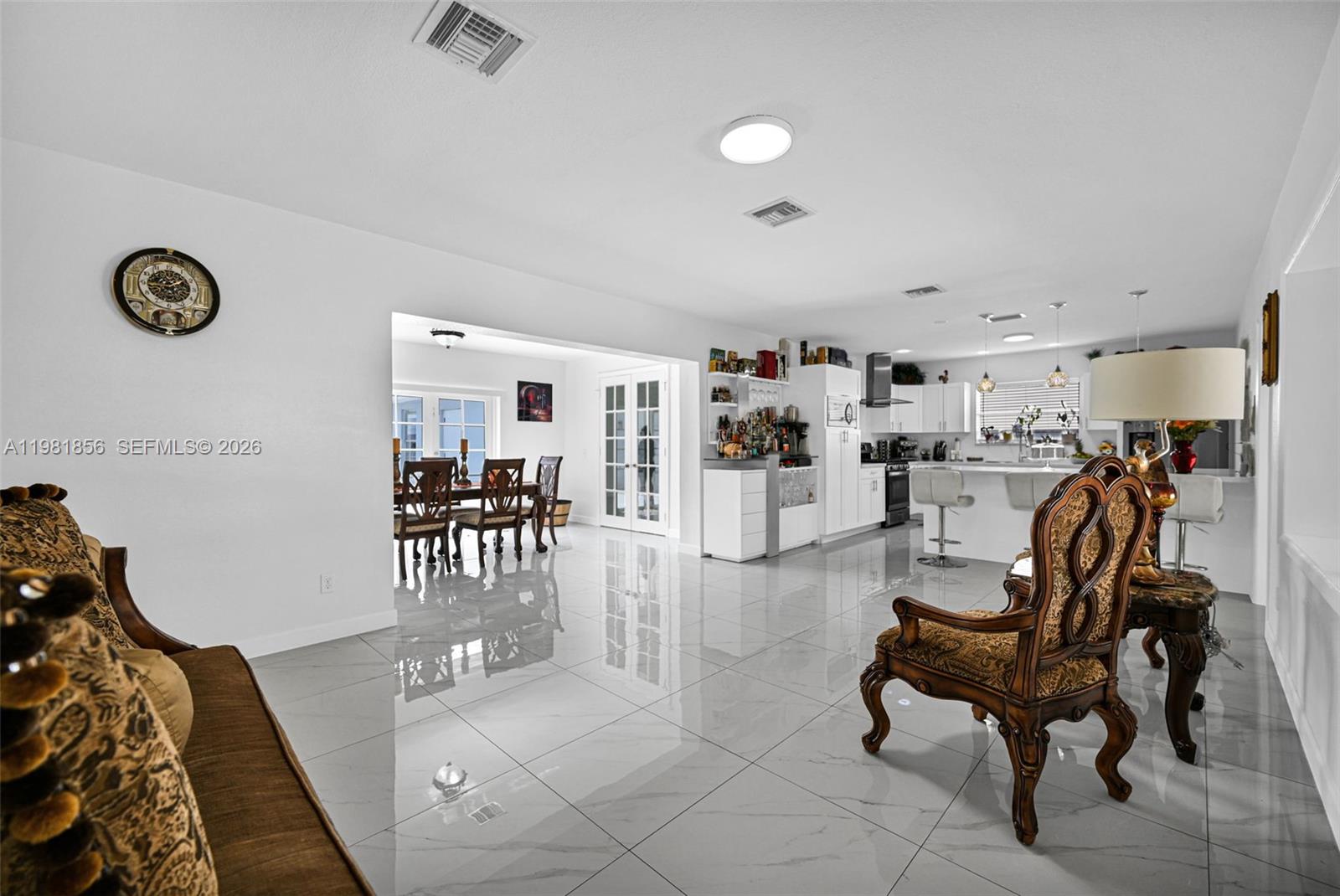 756 West 53rd Street Hialeah, FL 33012 - Photo 8 of 65 a living room with furniture and a table
