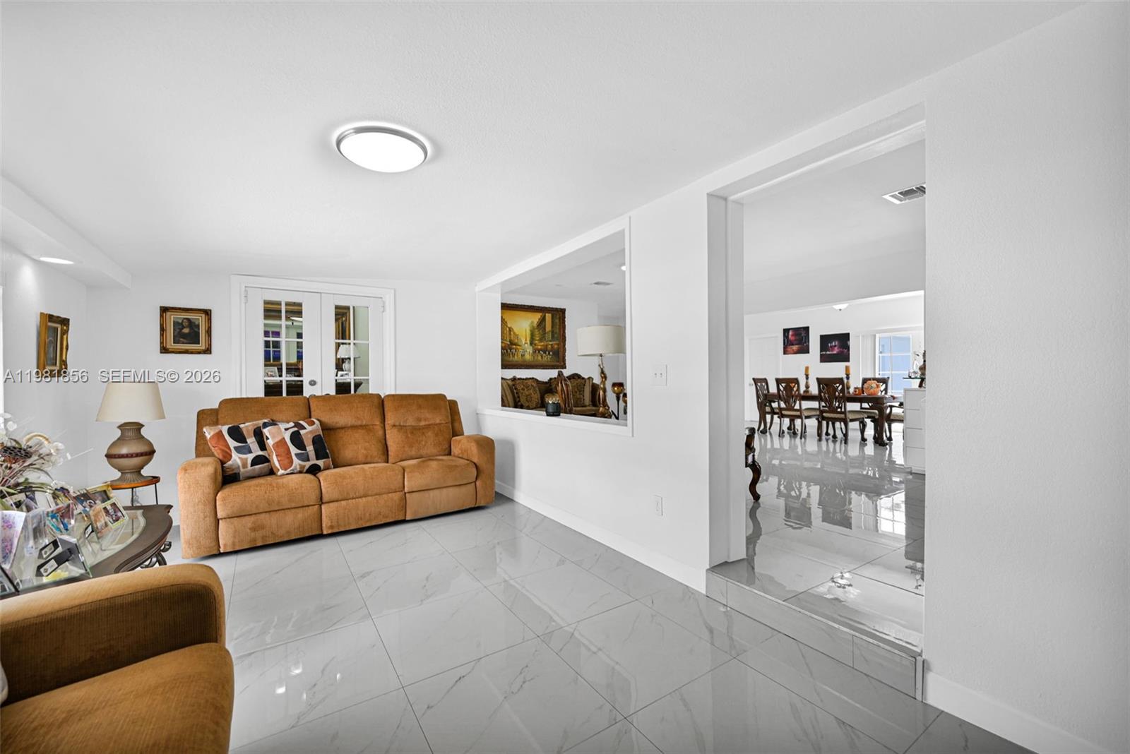 756 West 53rd Street Hialeah, FL 33012 - Photo 10 of 65 a living room with furniture and a table