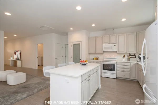 a view of storage and utility room with closet