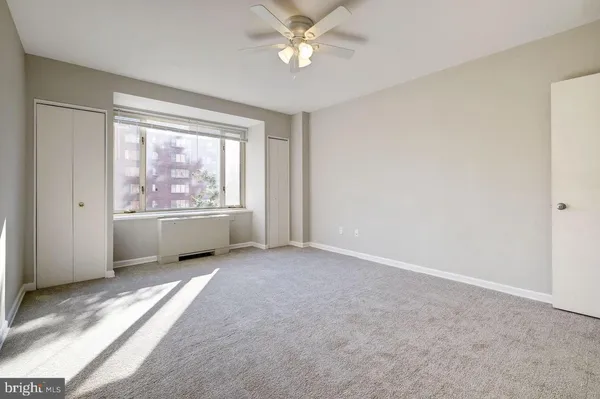 a view of an empty room with a window