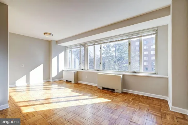 a view of an empty room with a window